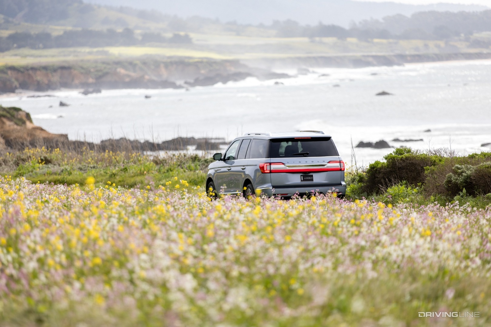 Lincoln Navigator driving down coastal road