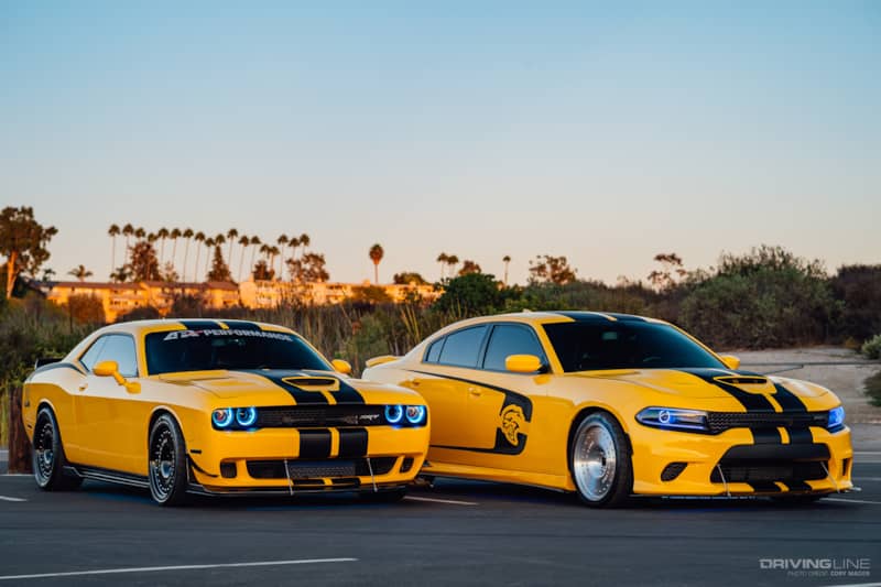 Dodge Charger and Dodge Challenger in yellow on Nitto tires, parked side by side