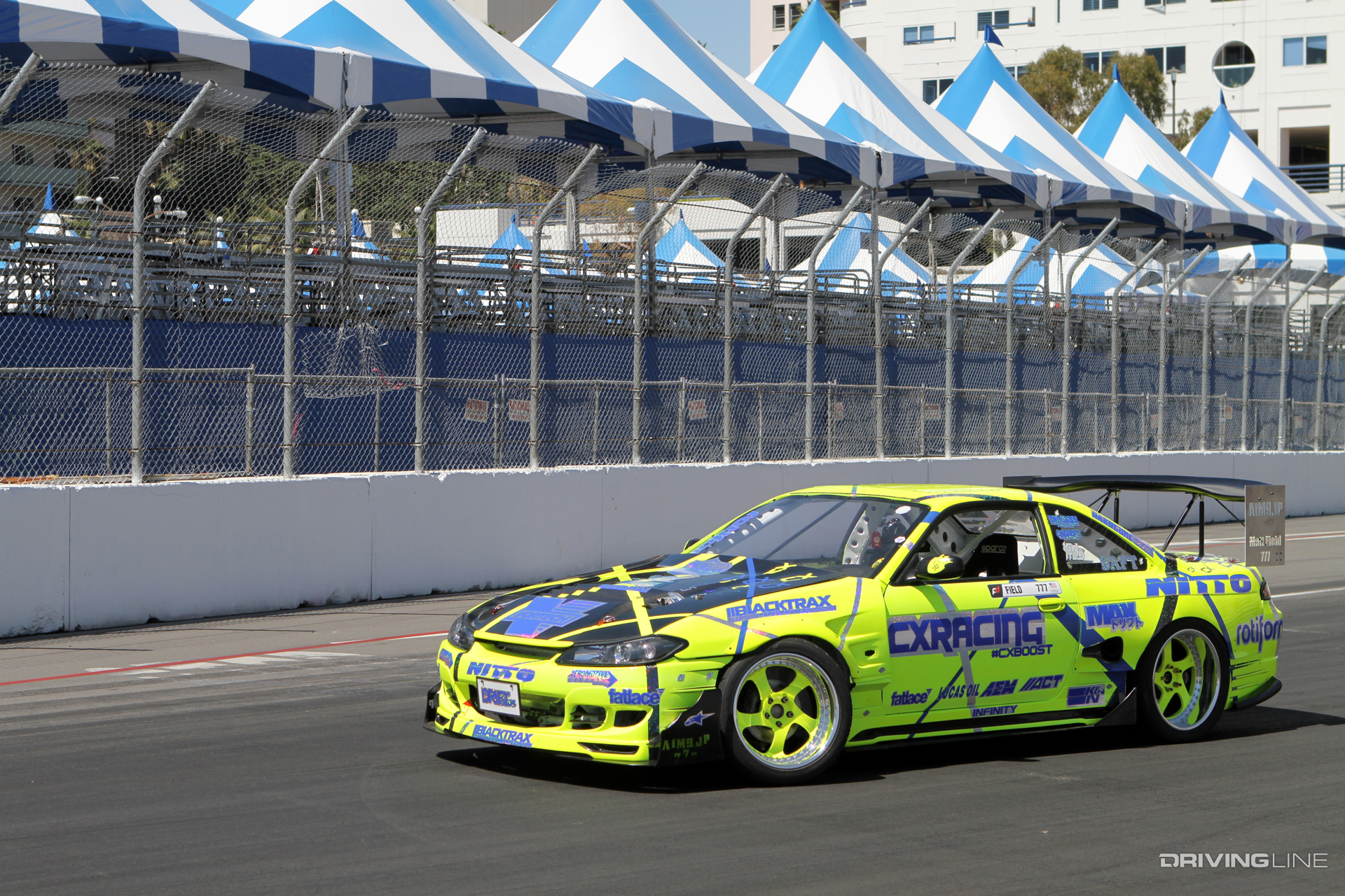 A Vortech supercharger peaks out of the hood of Matt Field's Nissan S14 ahead of the Long Beach round of Formula Drift in 2014