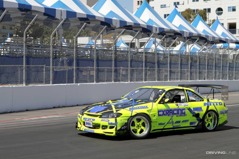 A Vortech supercharger peaks out of the hood of Matt Field's Nissan S14 ahead of the Long Beach round of Formula Drift in 2014