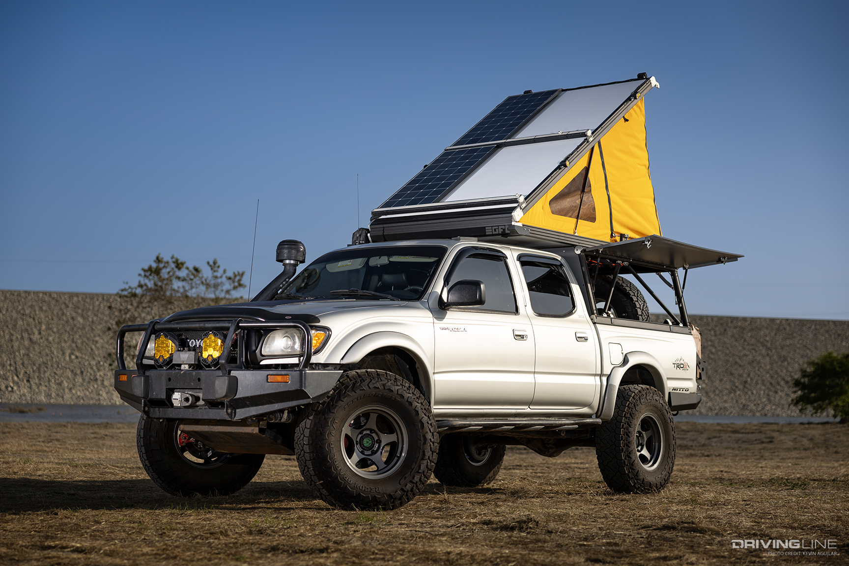 tent and solar panels extended on overland ready toyota tacoma