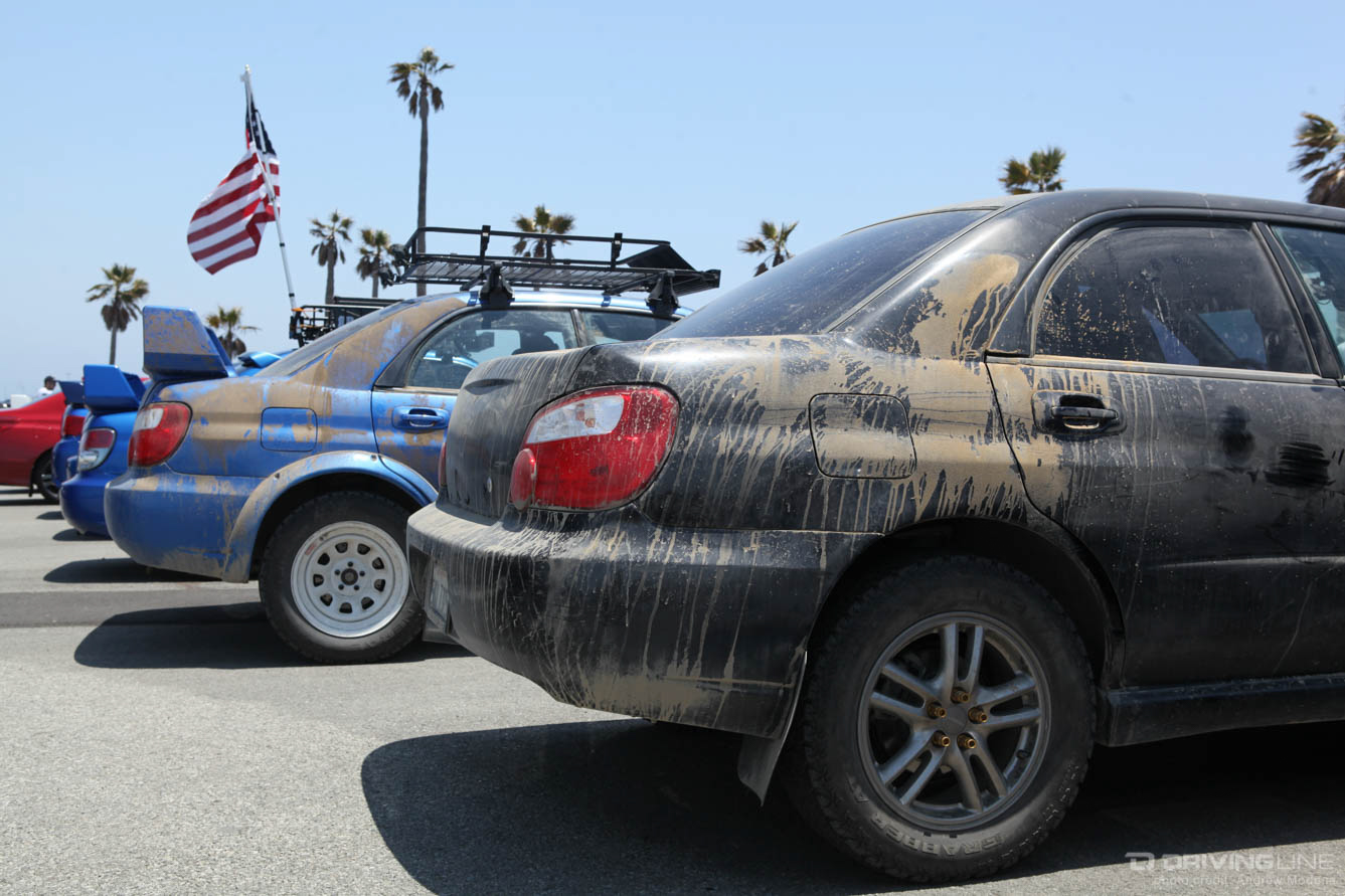 Subarus covered in dirt