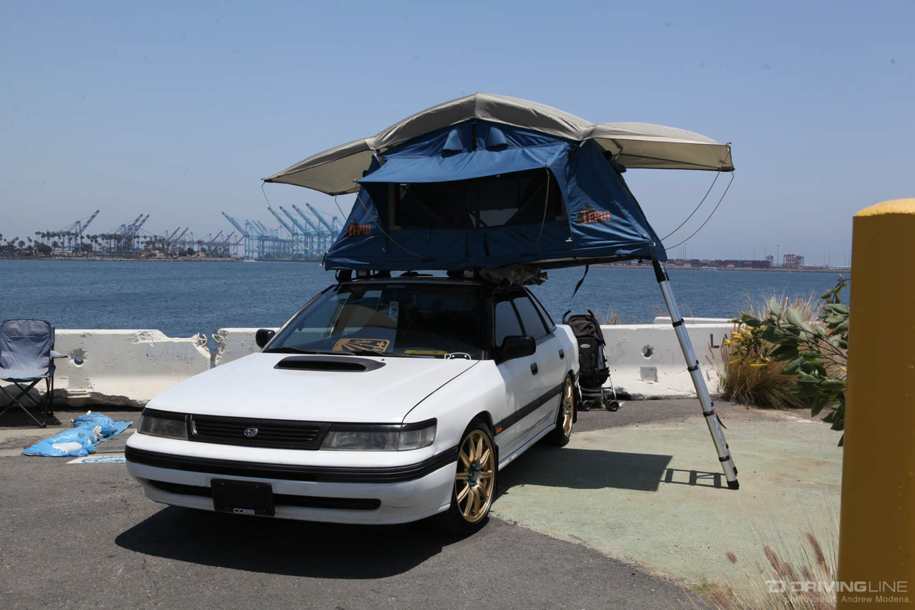 white Legacy Subaru on gold STi wheels