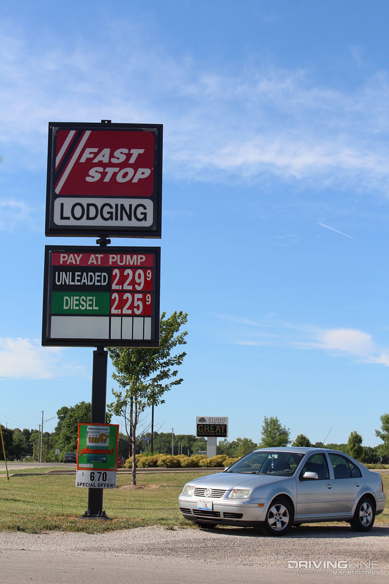 Volkswagen Jetta TDI beneath a gas station sign