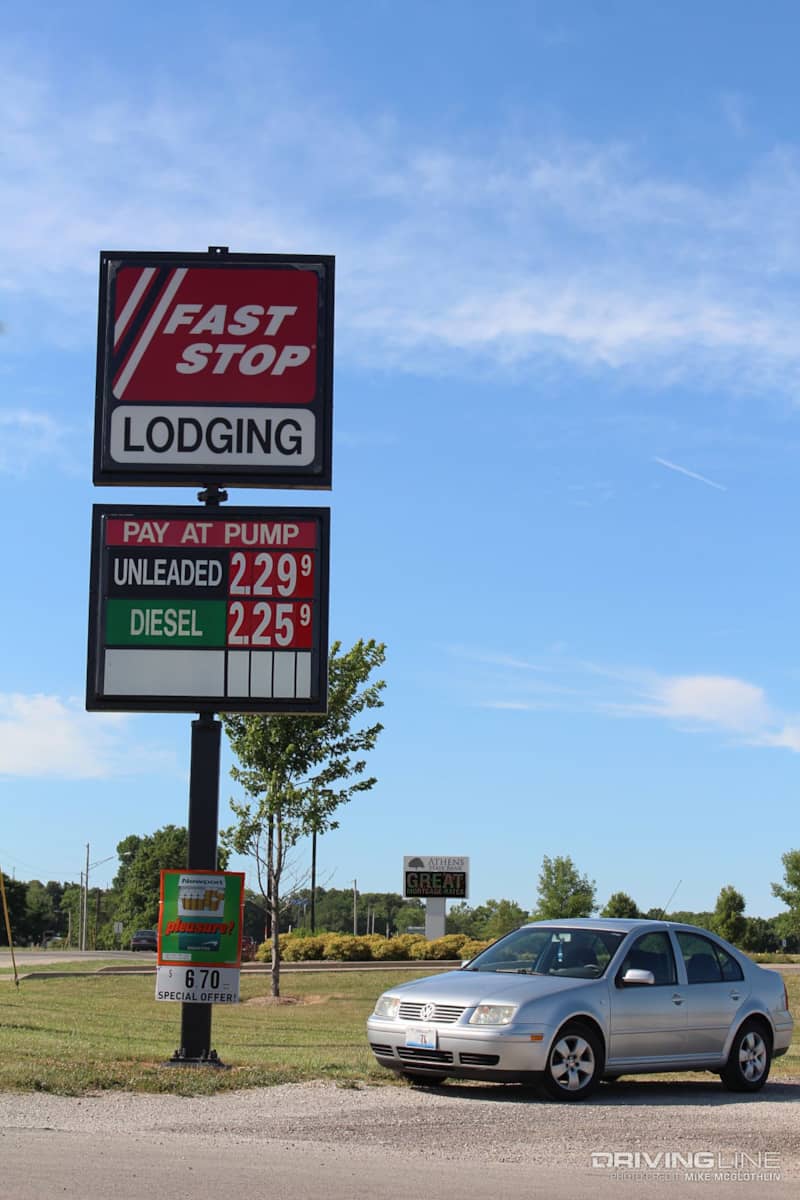 Volkswagen Jetta TDI beneath a gas station sign
