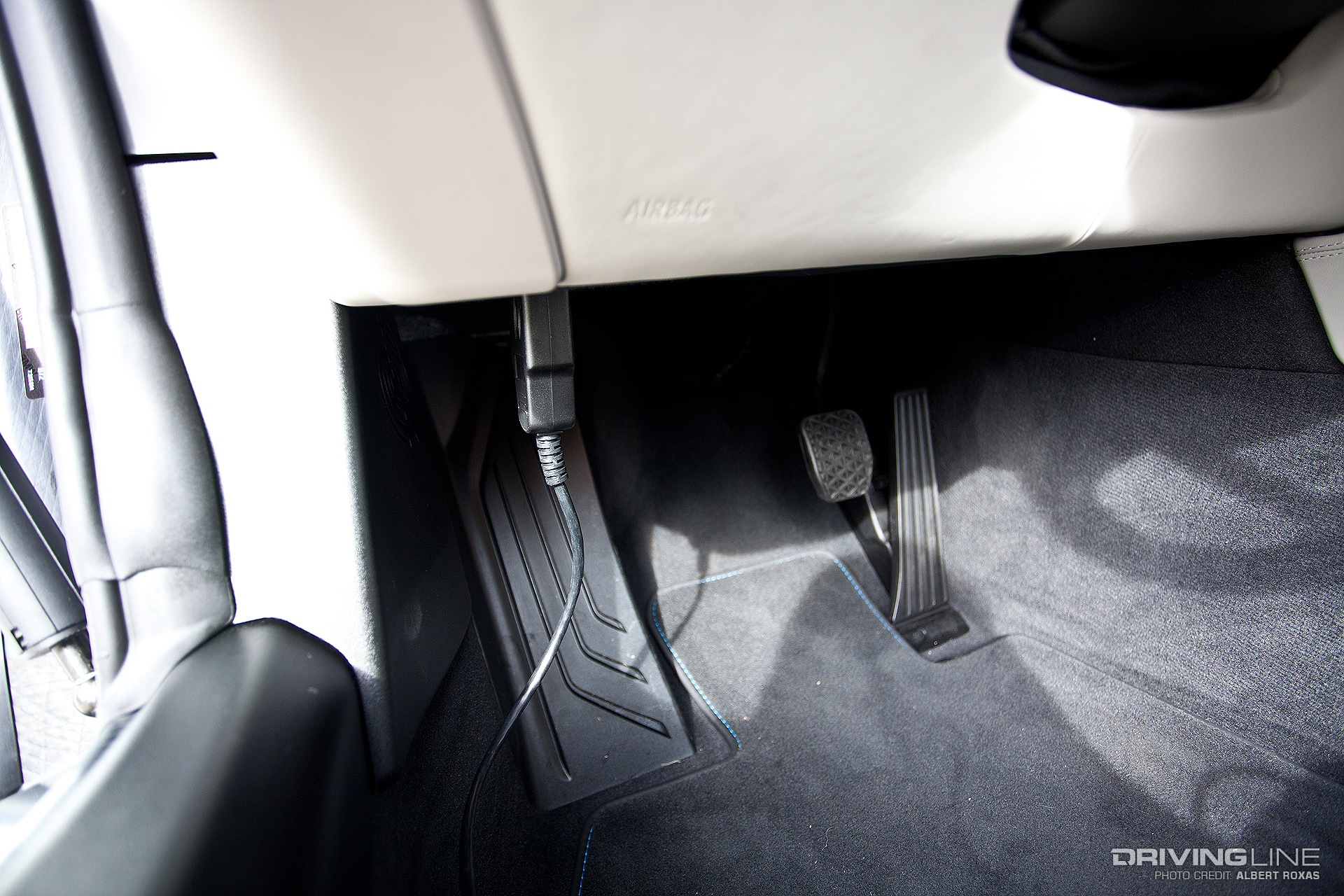 Wire plugged in near the gas and brake pedals