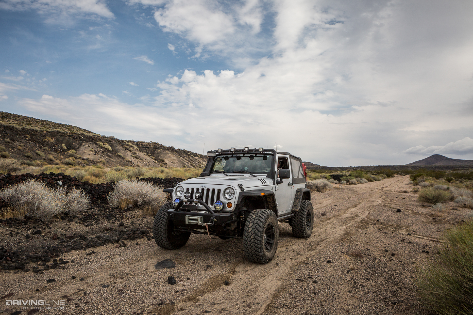 Jeep Wrangler and black basalt flows on side of Aiken Mine Trail