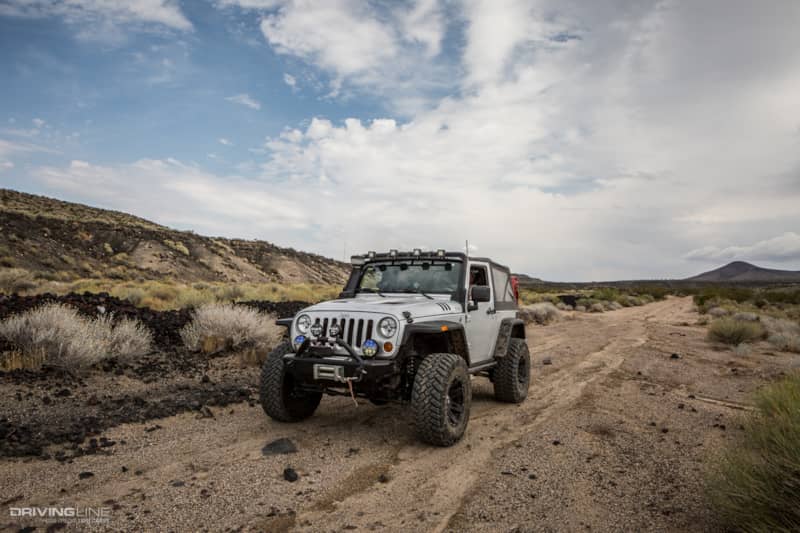 Jeep Wrangler and black basalt flows on side of Aiken Mine Trail