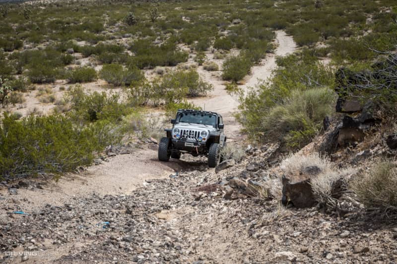 Jeep Wrangler navigating tricky terrain on Aiken Mine Trail