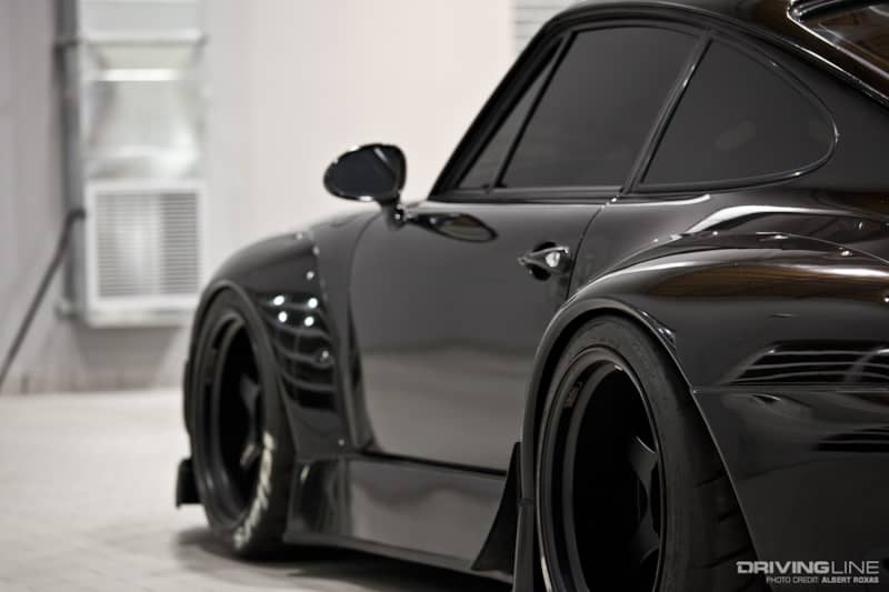 driver side view of black RWB Porsche