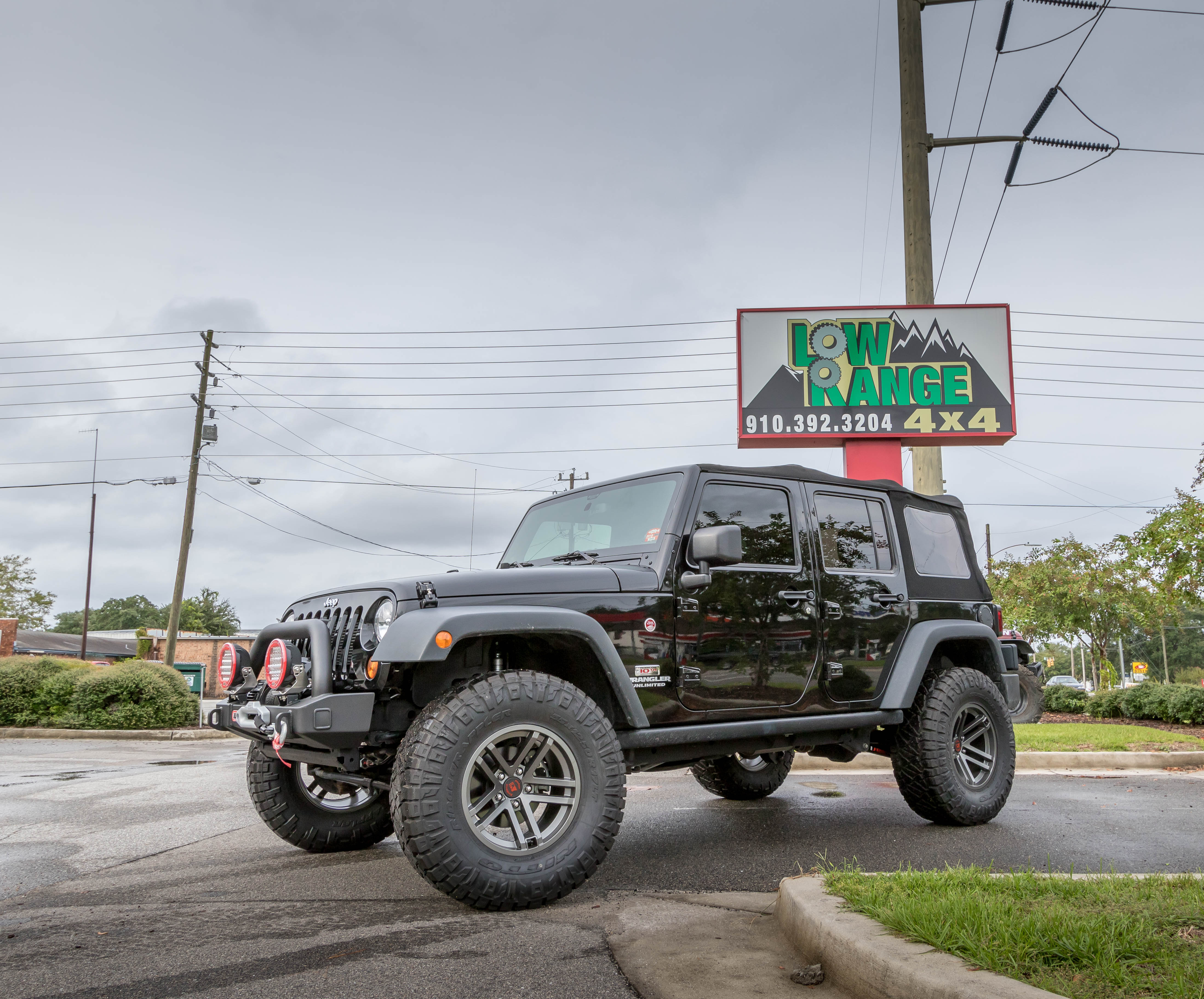 Jeep in front of Low Range 4x4 shop sign