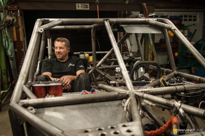 Jason Scherer sitting in Ultra4 buggy chassis