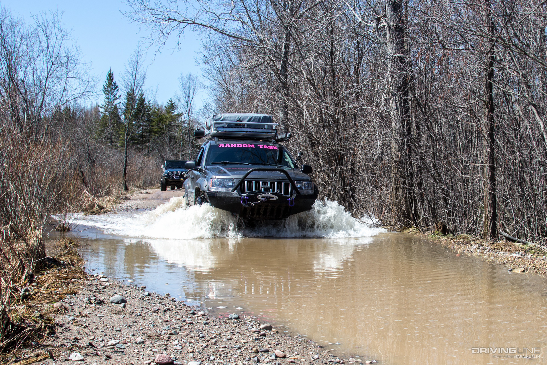 Jeep WJ crossing water on Drummond Island