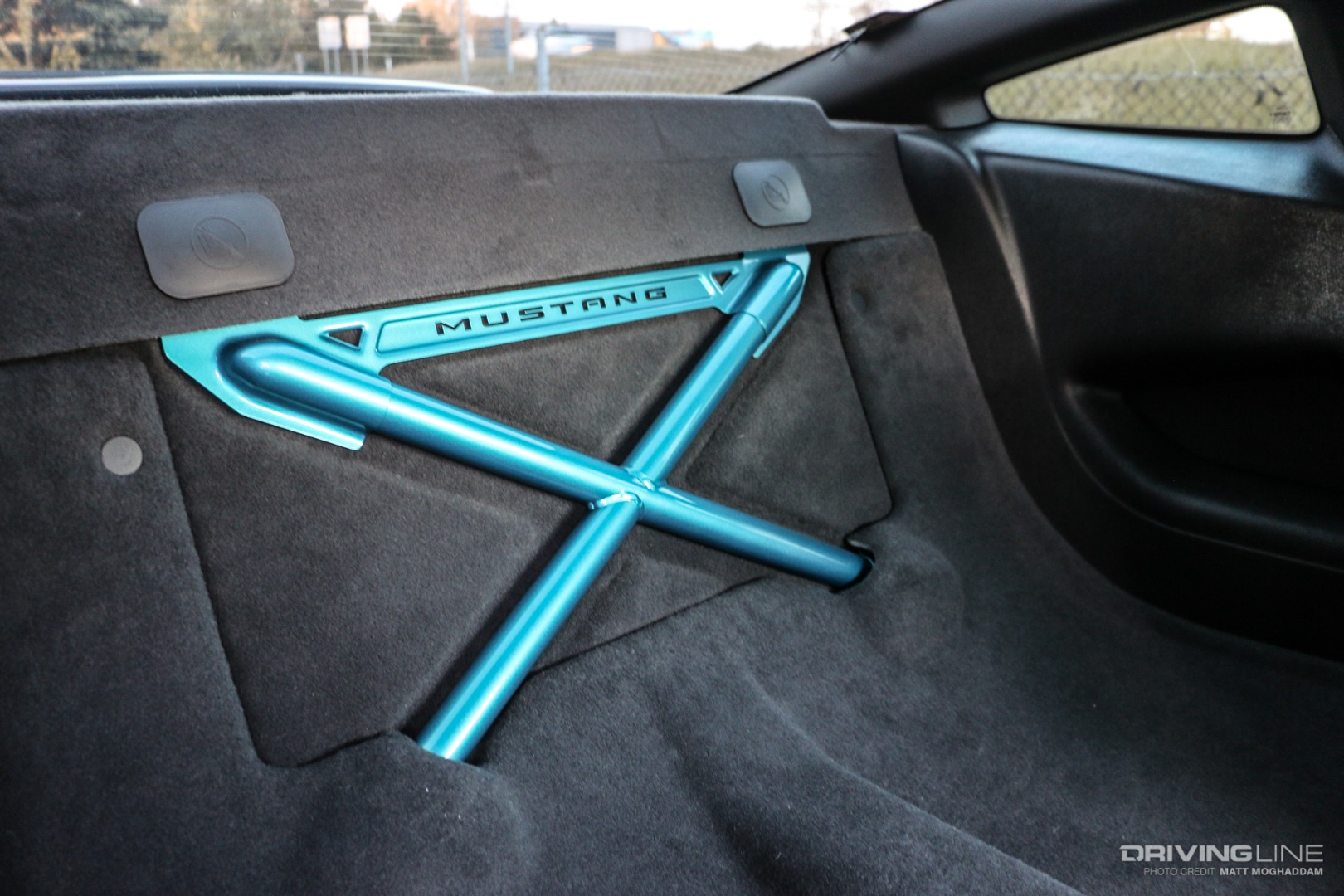 Rear seat delete and cross-brace give the interior a more performance-based look.