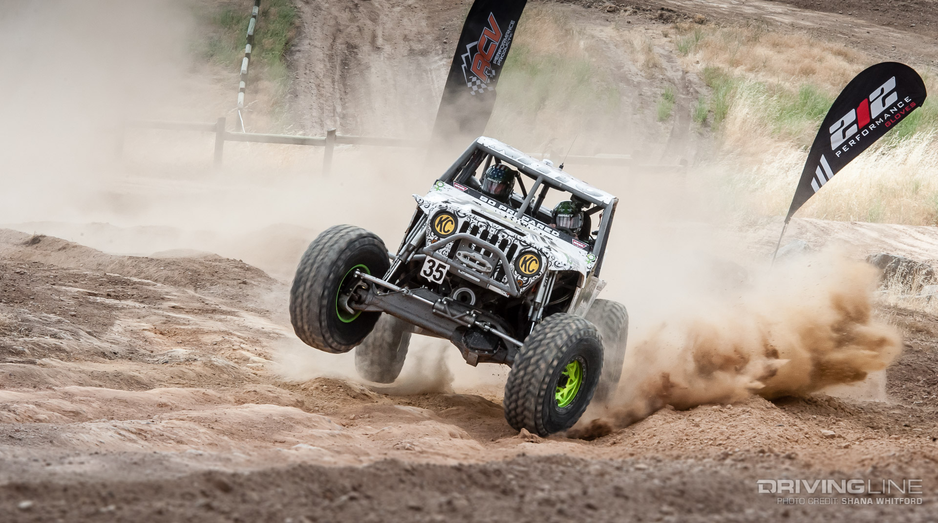 Bailey Campbell lifting a tire around a hill