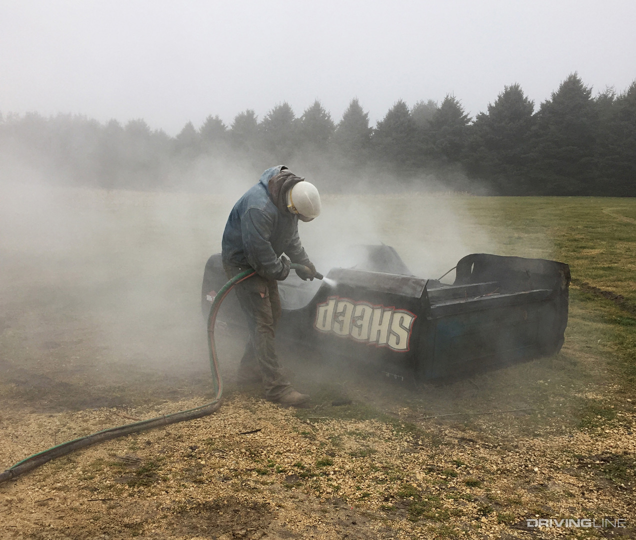 Person Media Blasting a Ford Bed