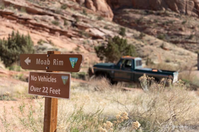 Moab Rim Trail marker with ford truck in background