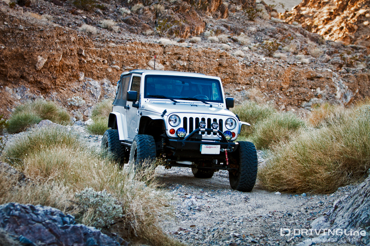 Jeep Wrangler driving on a trail