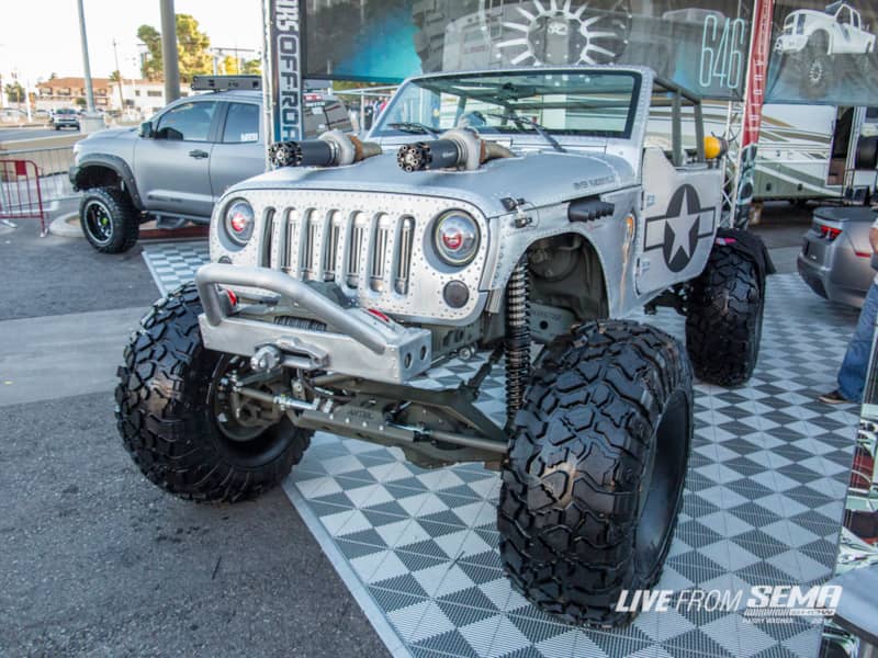 How do you top turbochargers poking out through the hood? You put Gatling guns on the front of them! River Raider built this aircraft-inspired Wrangler complete with custom riveted aluminum panels and a custom interior. While it was built to turn heads in the Dub booth, it is also a legit wheeling rig, complete with one ton axles, coilover shocks, and full hydraulic steering. We would just hate to get a dent in it.