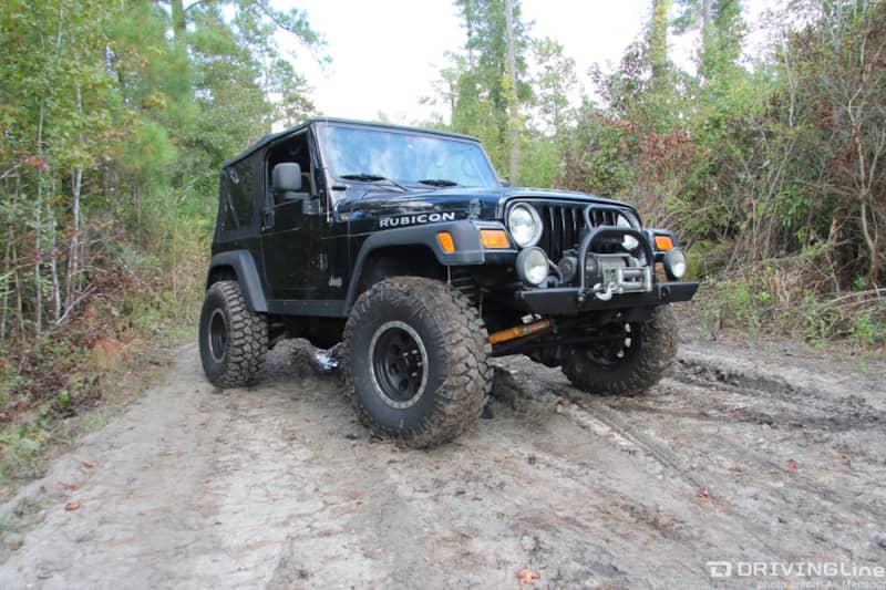 Jeep Wrangler TJ on a muddy trail