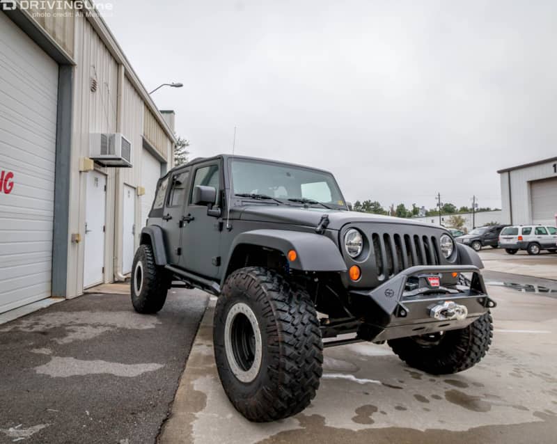 Front of a Jeep Wrangler JK with a 3M 1080 Satin Black vehicle wrap installed