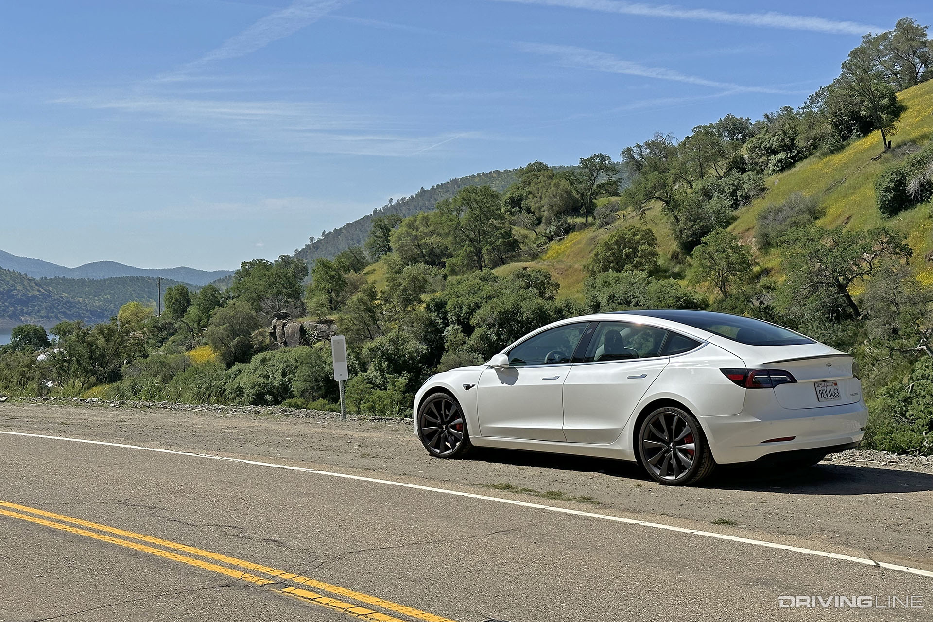 Tesla Model 3 Performance White on Mountain Road