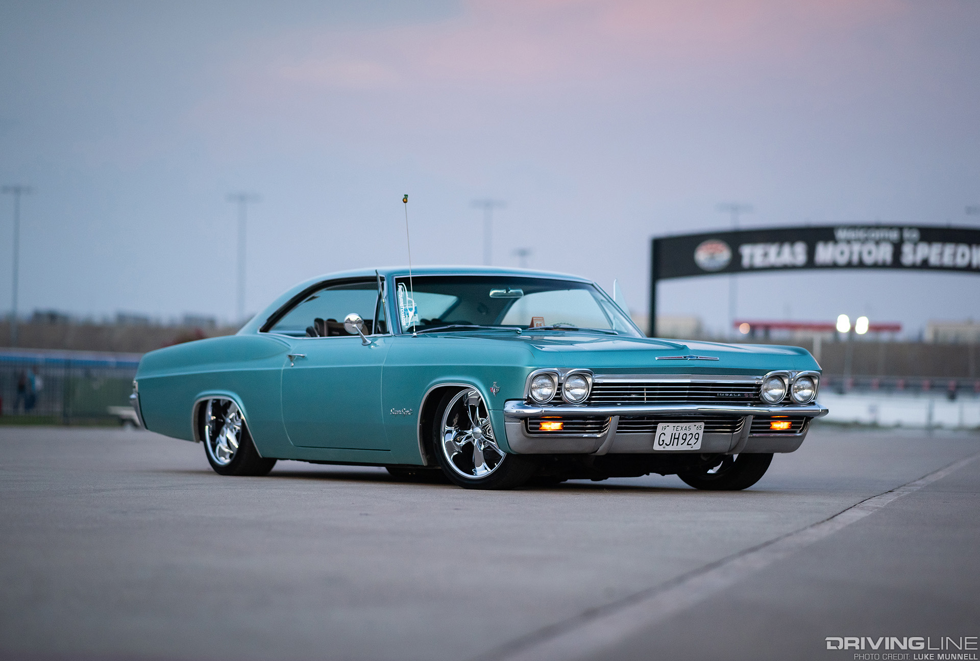 nitto NT555 G2 tires on 65 impala parked at texas motor speedway