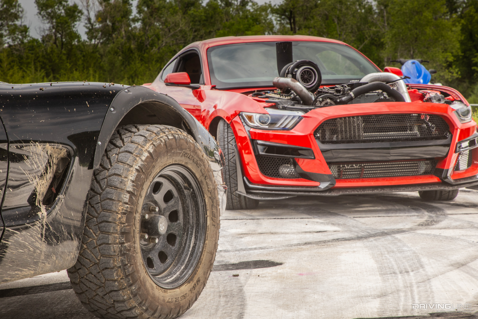 Smokestang next to off-road corvette