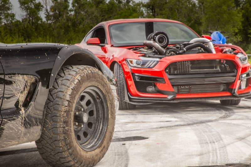 Smokestang next to off-road corvette