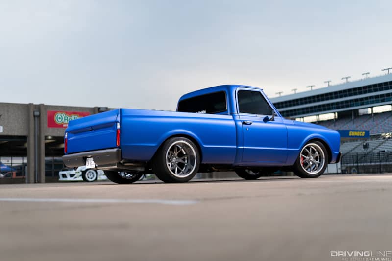 Passenger side rear view of lowered Chevy truck with Nitto INVO tires