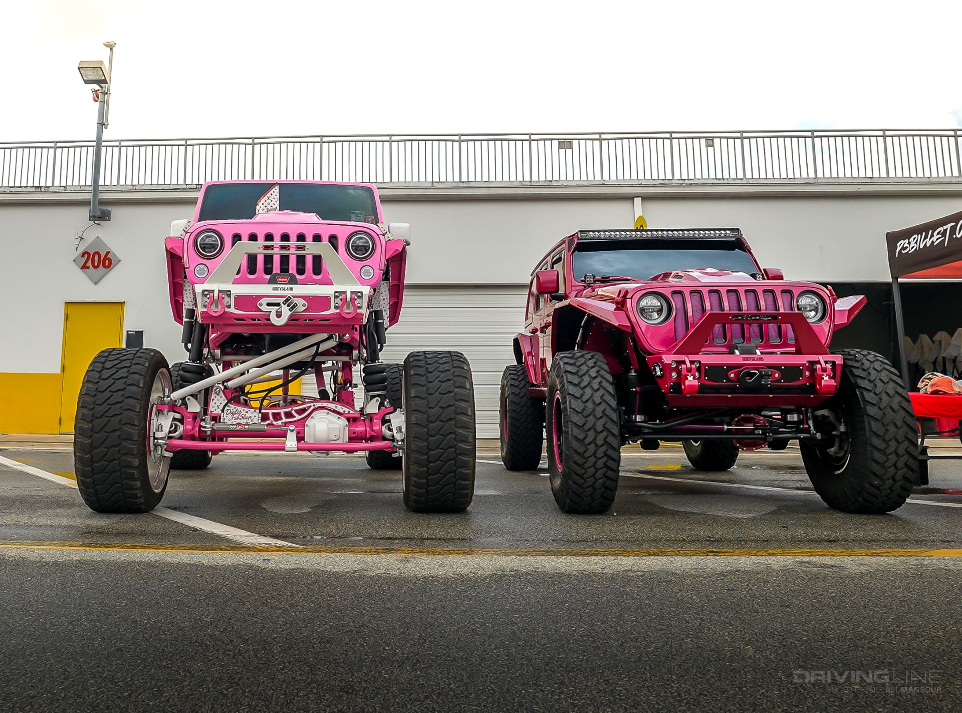 Lifted pink Jeep Wranglers Jeep Beach 2024
