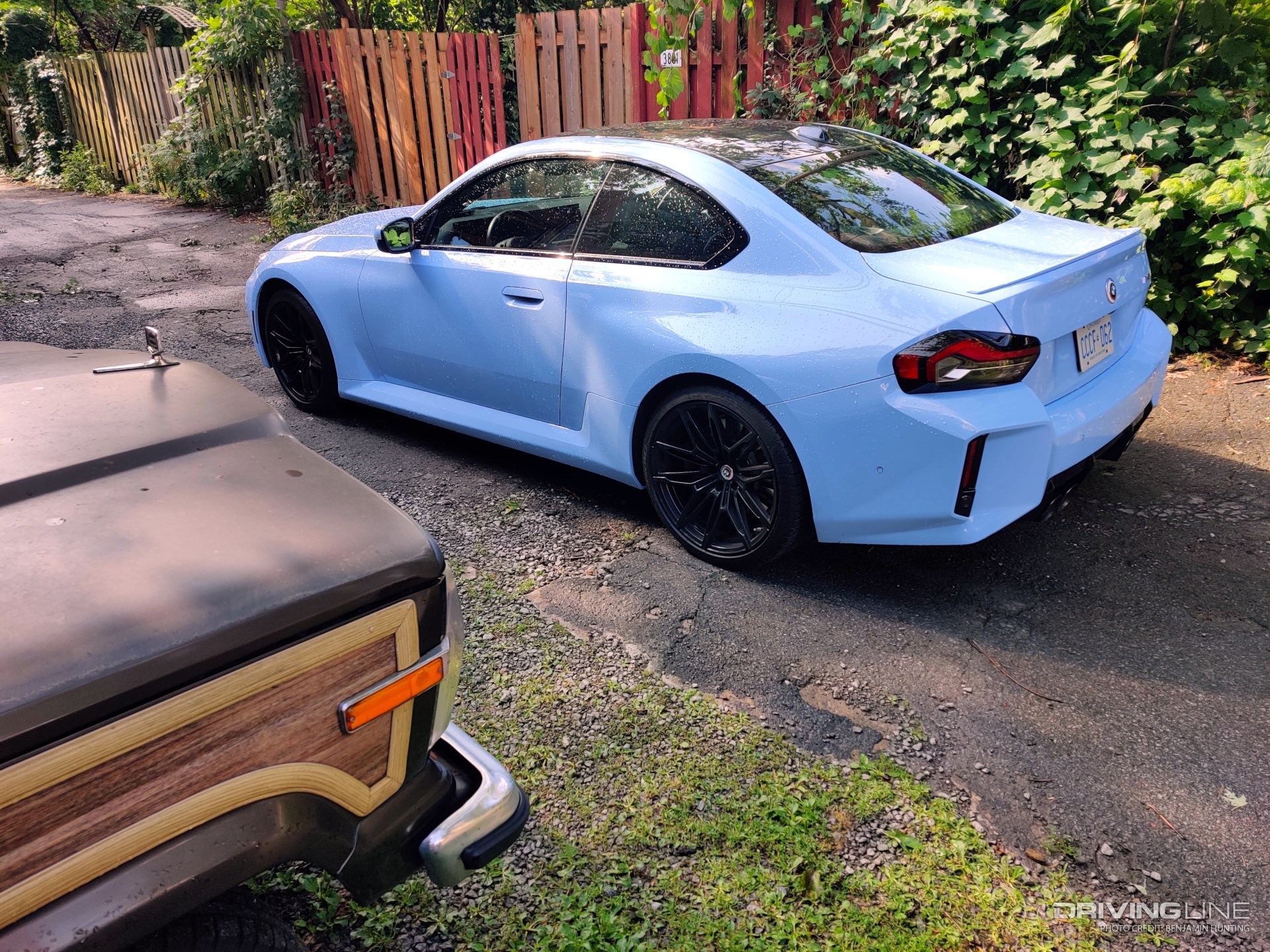 2023 BMW M2 rear view with Jeep
