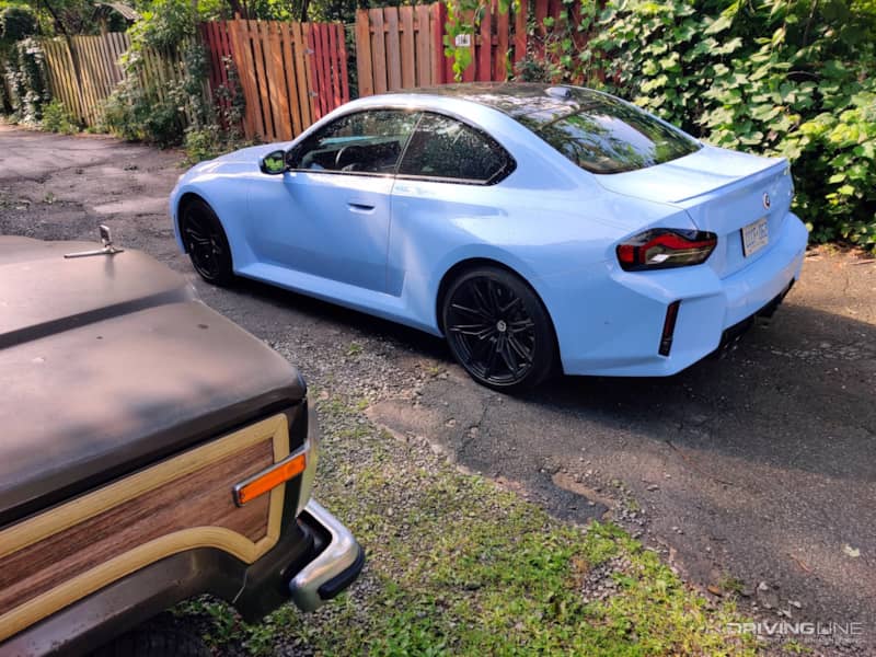2023 BMW M2 rear view with Jeep