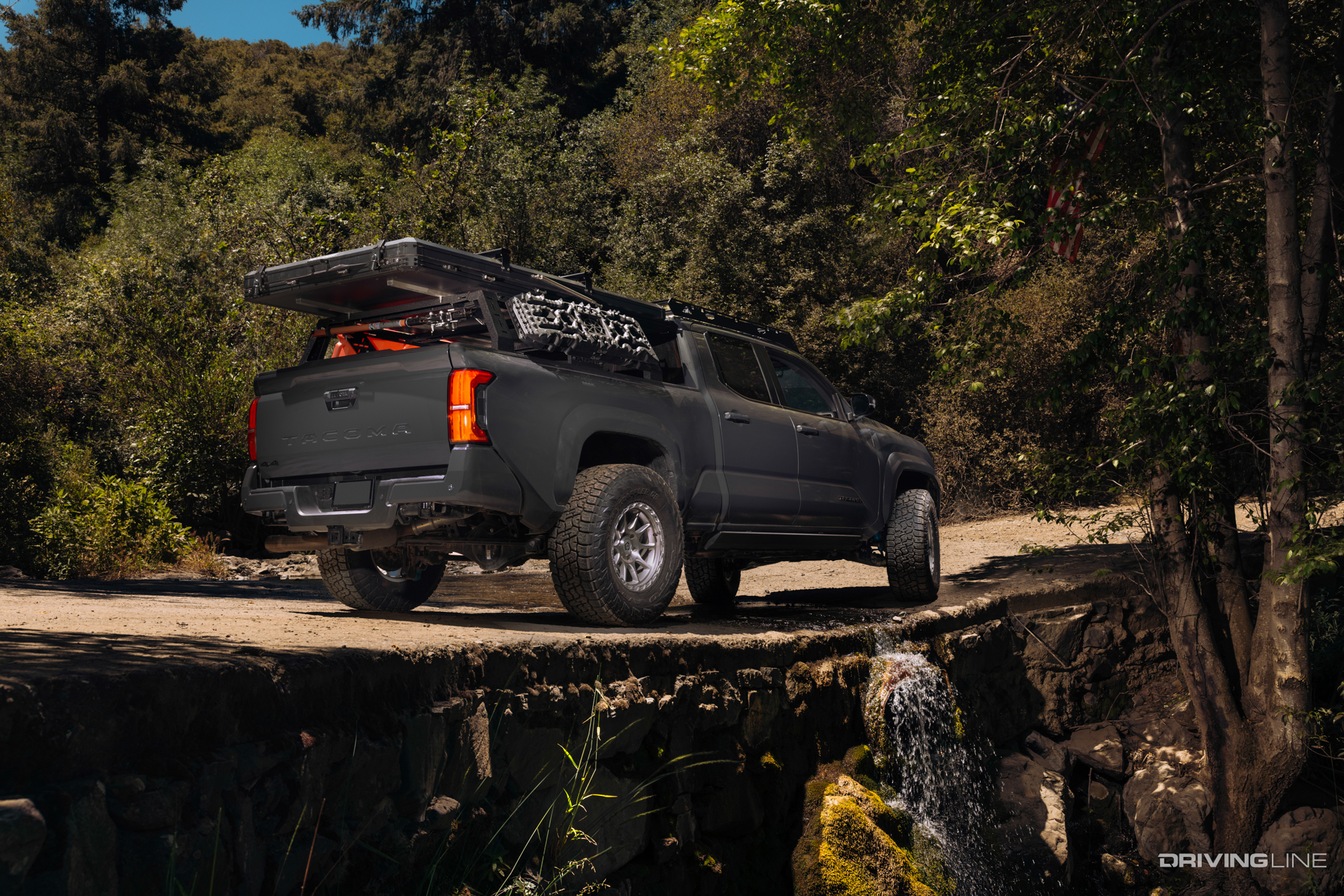 Nitto Terra Grappler G3 A/T tires on Toyota Tacoma on a dirt trail