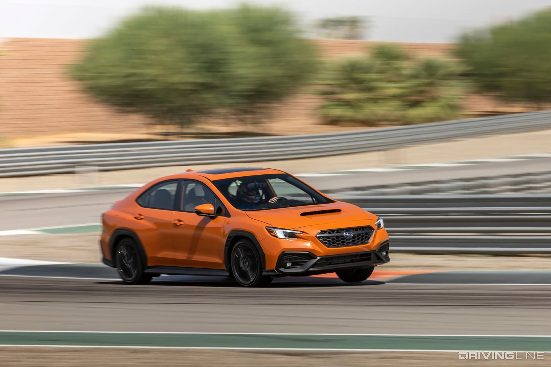 Orange Subaru WRX on Track
