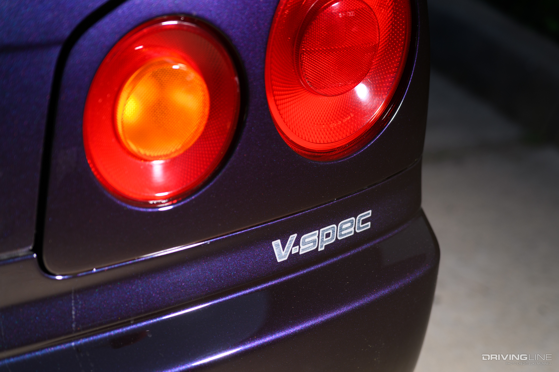V-spec logo on back of TJ Hunt's Nissan R34 GT-R