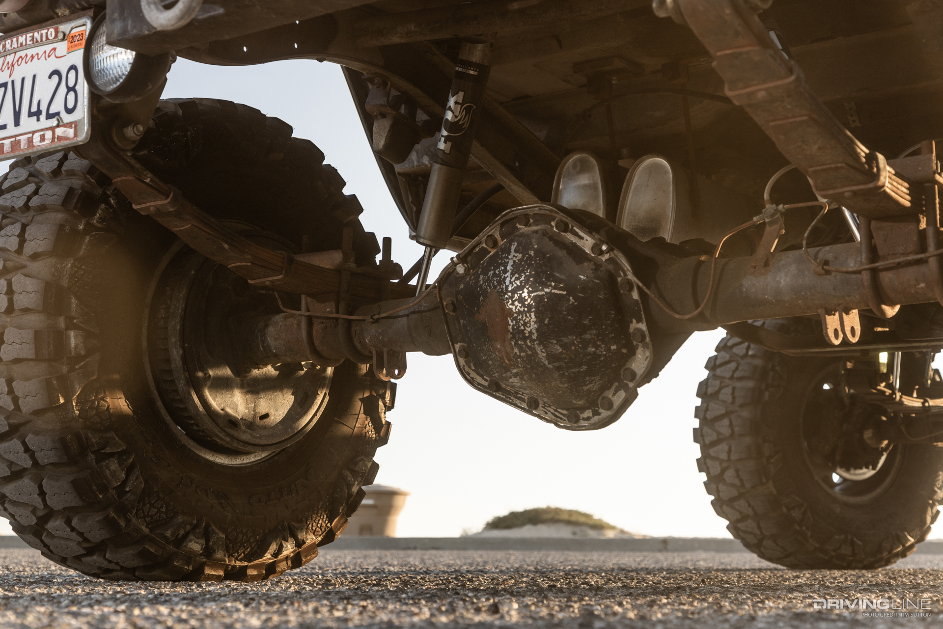 nitto mud grapplers on rear axle of toyota fj40 truck