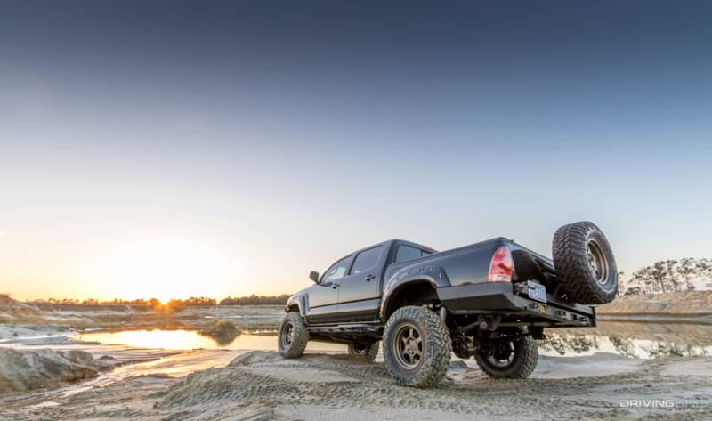Toyota Tacoma Black overland build nitto trail grappler rear view