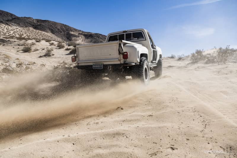 Rear end of lifted Chevy K!0 Square Body truck on Nitto 40 inch Trail Grappler tires