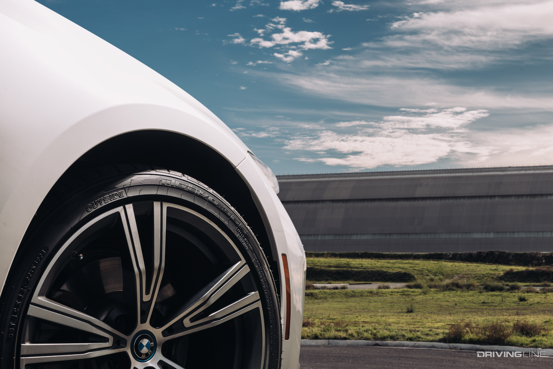 Nitto Motivo 365 all season tire on sedan on sunny day