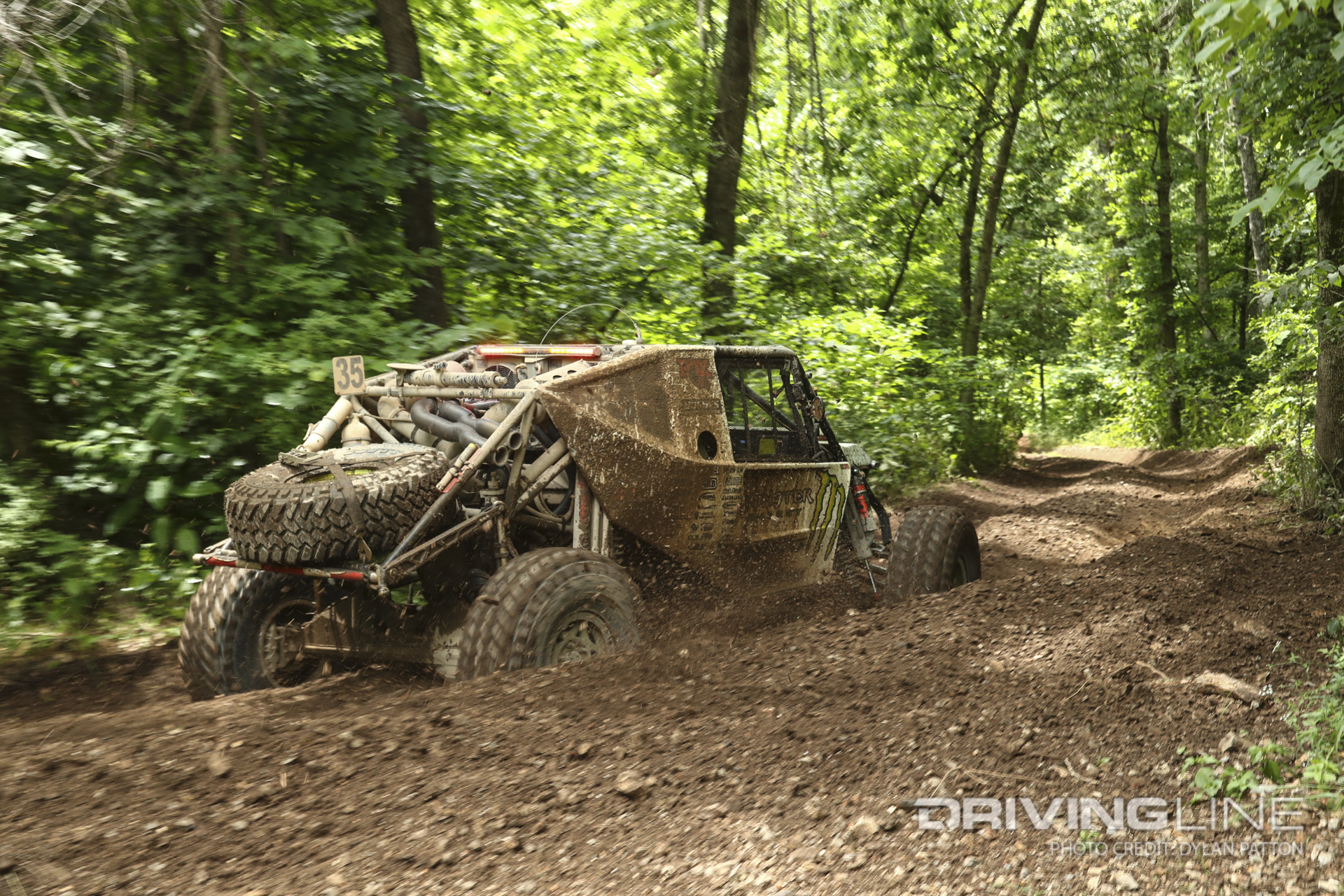 Bailey Campbell fighting her way though the deep ruts in the woods off-road racing at 2023 Ultra4 Visions OK