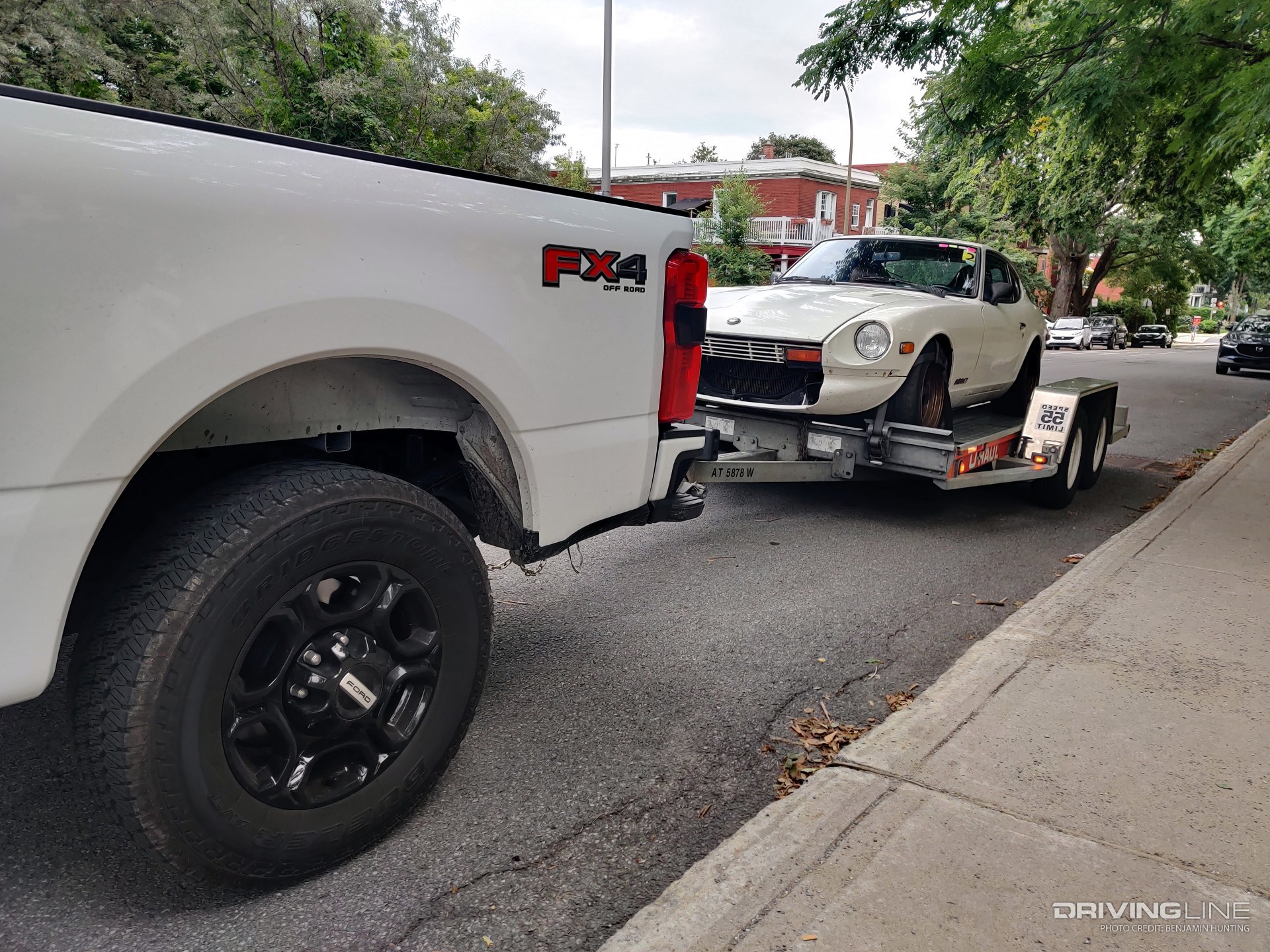 2023 Ford F-250 XL towing rear quarter with trailer