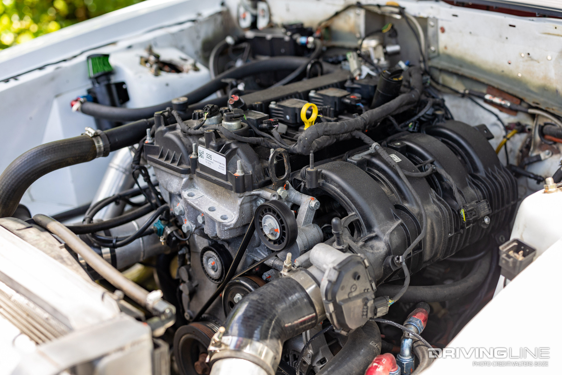 Intake side of a 2.3L EcoBoost engine inside of a Fox Body Mustang