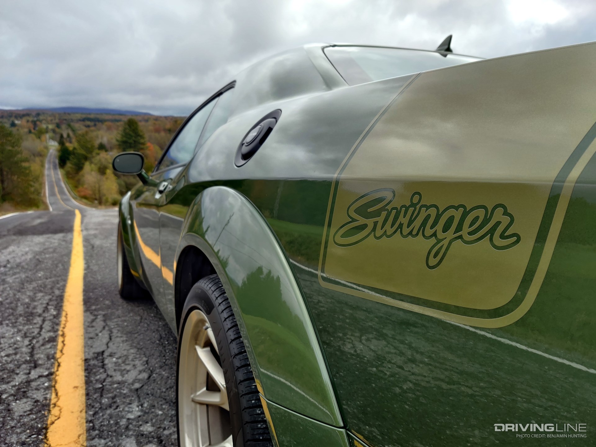 2023 Dodge Challenger R/T Scat Pack Swinger Last Call rear quarter view down hilly road focus on Swinger decal on rear fender