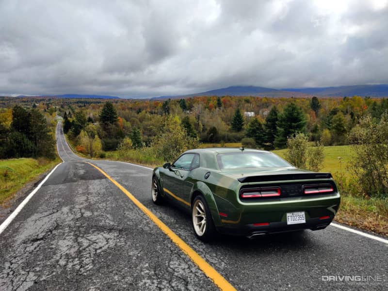 2023 Dodge Challenger R/T Scat Pack Swinger Last Call looking down a mountain road from behind