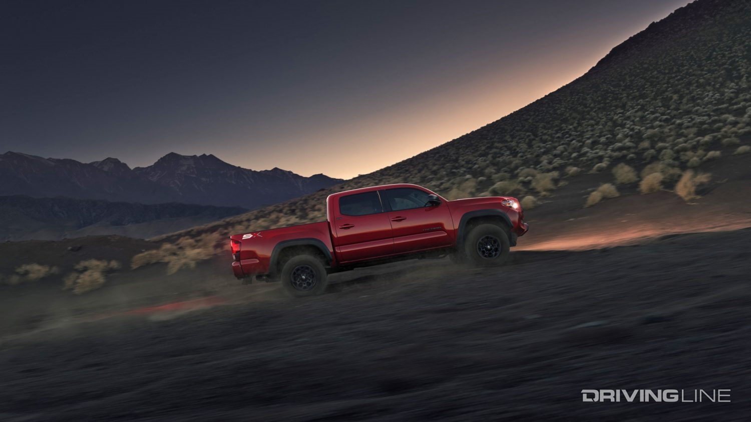 2023 Toyota Tacoma uphill in red