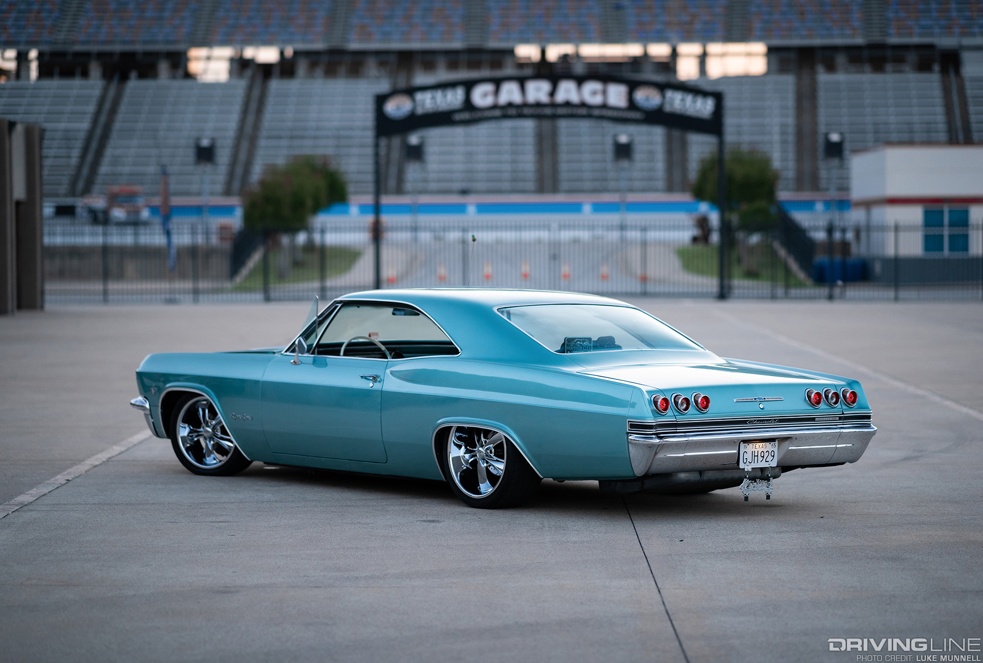 65 chevy impala custom parked at texas motor speedway