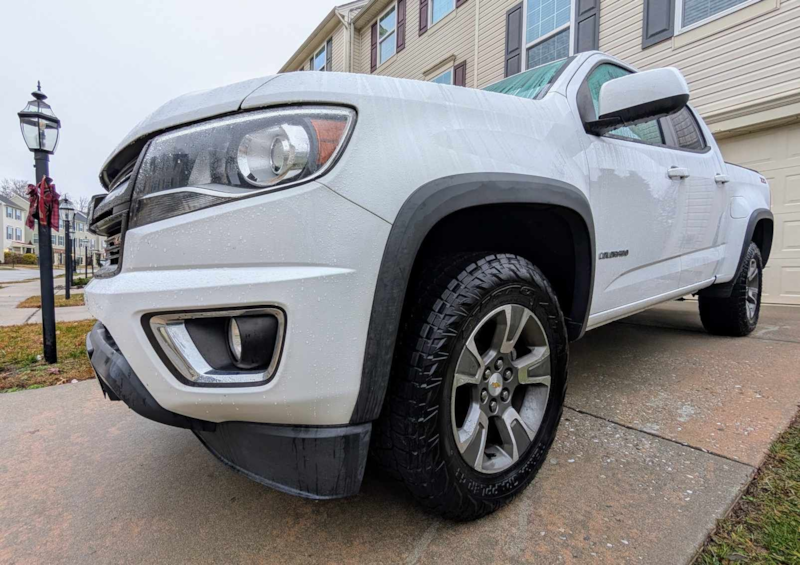 Close up of Nitto Terra Grappler G3 tires on a white Chevy Colorado pickup truck
