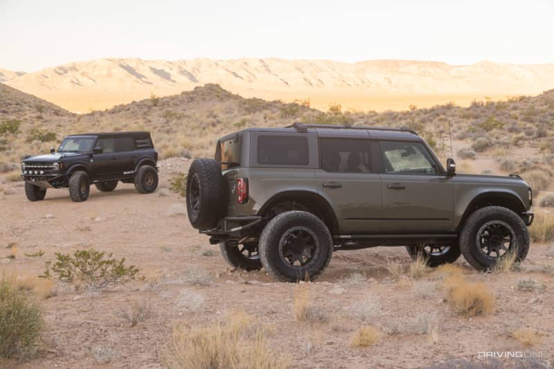 a Pair ofLGE-CTS customized Broncos in the desert on Nitto Tires