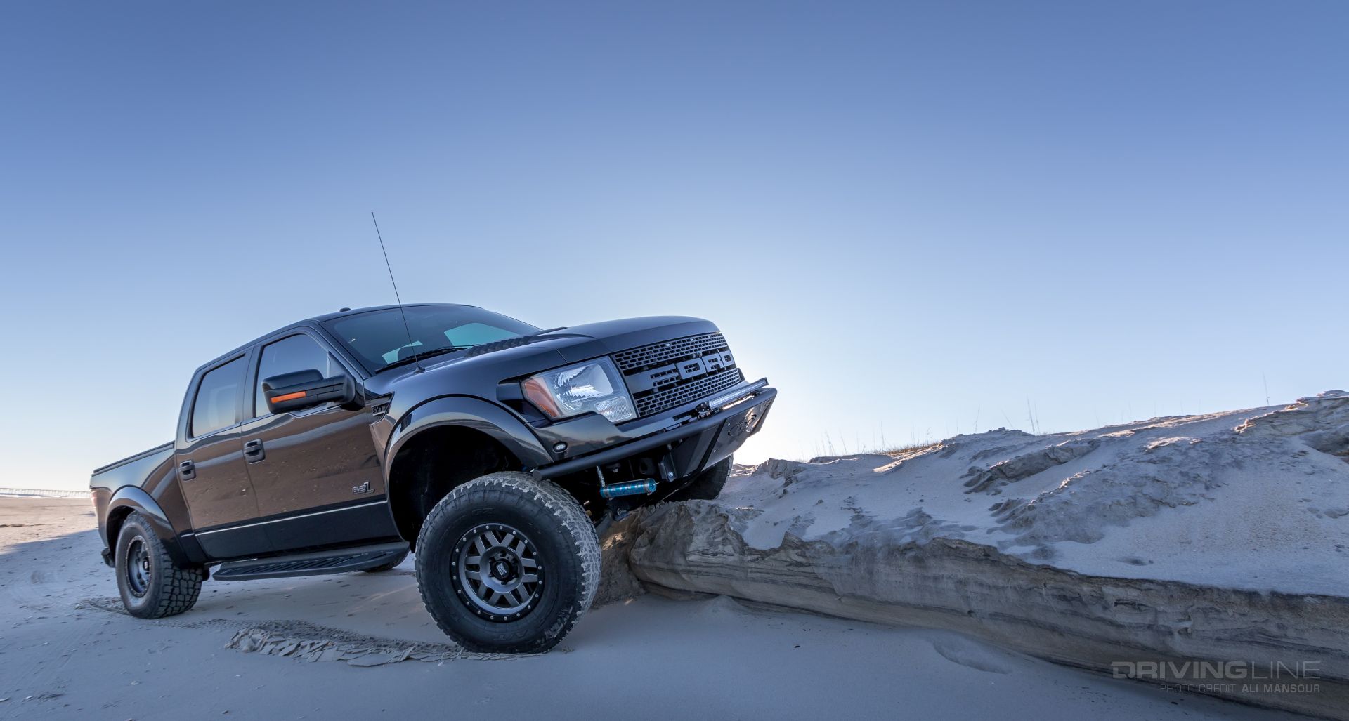 Gen 1 Ford Raptor Black flexing suspension on beach